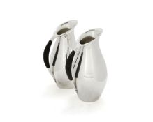 Georg Jensen, a pair of Danish silver water jugs or pitchers