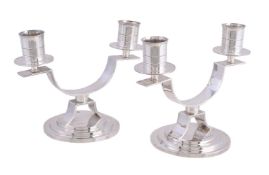 Harrods, a pair of Art Deco silver twin light low candelabra by Harrods Ltd