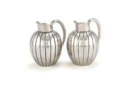 Georg Jensen, a pair of Danish silver Bernadotte cream jugs or pitchers