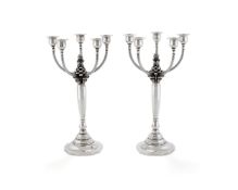 Georg Jensen, a pair of Danish silver five-light candelabra