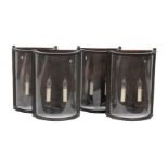 Charles Edwards, London, a set of four large bow fronted wall lanterns