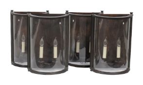 Charles Edwards, London, a set of four large bow fronted wall lanterns
