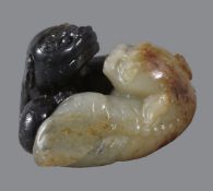 A Chinese celadon and black jade &#8216;twin Buddhist lions&#8217; group