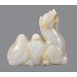 A Chinese pale celadon and russet jade Bactrian camel