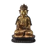 A Chinese gilt-bronze figure of Buddha