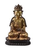 A Chinese gilt-bronze figure of Buddha