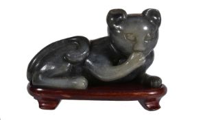 A grey and celadon jade &#8216;cat&#8217; carving