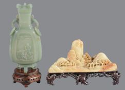 A Chinese celadon jade vase and cover