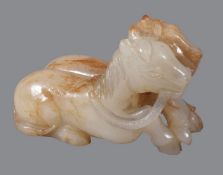 A Chinese white and russet jade &#8217;twin horse&#8217; group