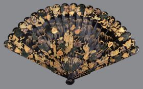 A Chinese lacquered bamboo brise fan