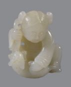 A Chinese pale celadon jade carving of a boy and cat