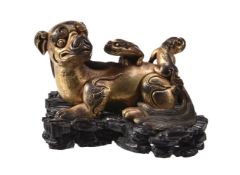 A Chinese gilt-bronze 'lion' scroll weight