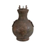 A Chinese archaic bronze storage vessel and cover