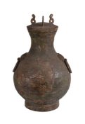 A Chinese archaic bronze storage vessel and cover