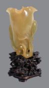 A Chinese yellow jade &#8216;lotus&#8217; vase
