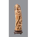 ϒ A Chinese ivory mother and child group