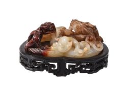 A Chinese white and russet jade &#8216;twin chilong&#8217; scroll weight