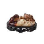 A Chinese white and russet jade &#8216;twin chilong&#8217; scroll weight