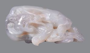 A Chinese jade or hard stone model of a dragon