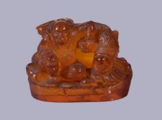 A Chinese amber seal chock