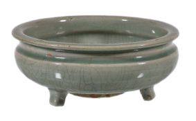 A Chinese celadon tripod censer