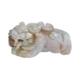 A Chinese white and green jadeite Buddhist lion