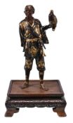 Miya-O Eisuke: A Japanese Parcel Gilt Bronze Figure of a Falconer