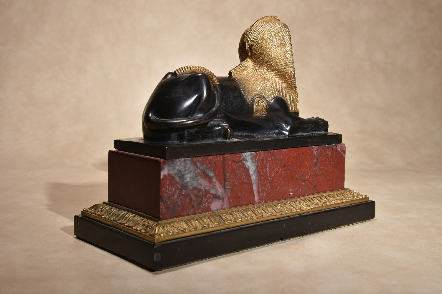 A pair of Continental gilt and patinated bronze and marble mounted models of recumbent sphinges - Image 5 of 6