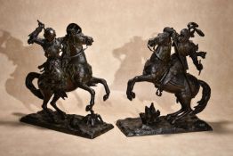A pair of Continental patinated spelter equestrian models of Tancred and Clorinda