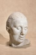 A sculpted white marble head of a woman