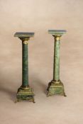 A pair of French onyx and gilt bronze mounted pedestals