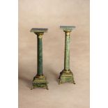 A pair of French onyx and gilt bronze mounted pedestals