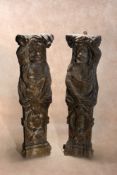 A pair of substantial sculpted oak terms