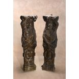 A pair of substantial sculpted oak terms