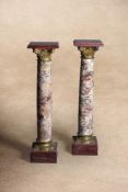 A pair of Continental marmo Breccia and gilt bronze mounted columnar pedestals