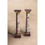 A pair of Continental marmo Breccia and gilt bronze mounted columnar pedestals