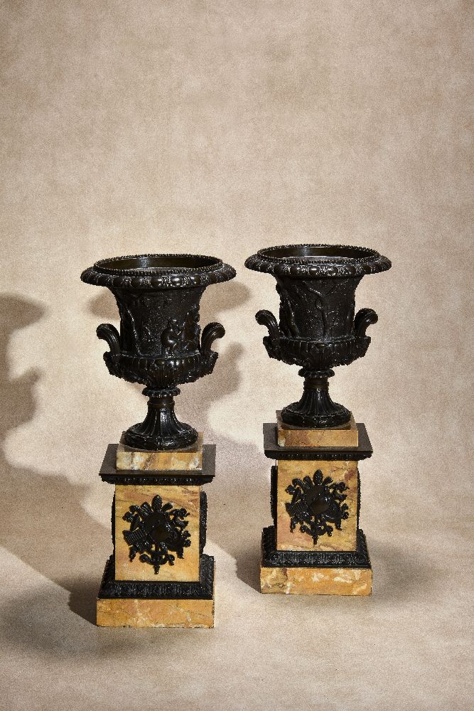 A pair of Italian patinated bronze and marmo Siena mounted models of Campana urns