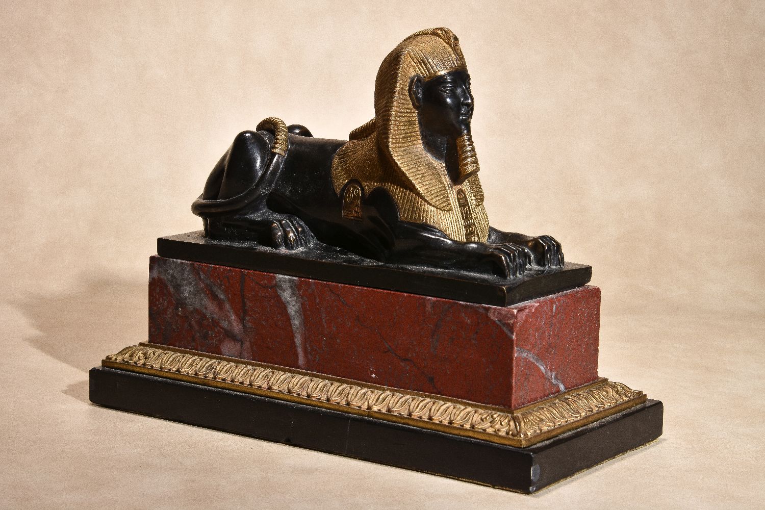 A pair of Continental gilt and patinated bronze and marble mounted models of recumbent sphinges - Image 3 of 6