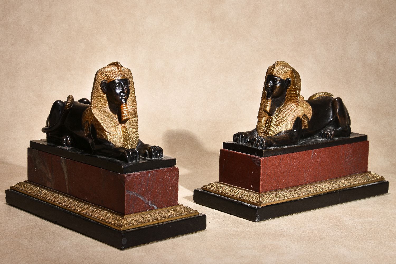 A pair of Continental gilt and patinated bronze and marble mounted models of recumbent sphinges - Image 2 of 6