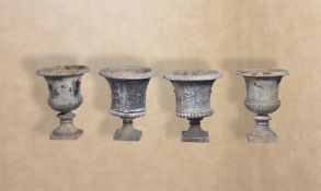 Two pairs of cast lead garden urns