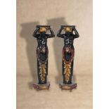 A pair of carved and painted wood term pilasters in Baroque taste