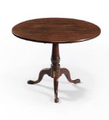 A George III mahogany tripod supper table