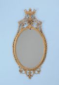 A George III gilt carton pierre wall mirror