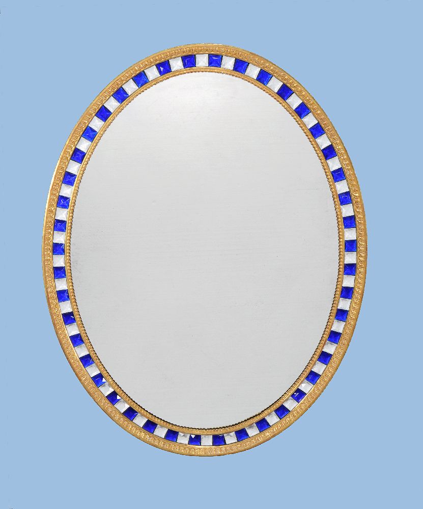 A giltwood oval wall mirror