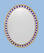 A giltwood oval wall mirror