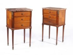 A pair of French mahogany bedside tables