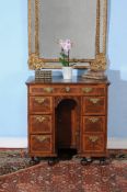 A Queen Anne walnut kneehole desk