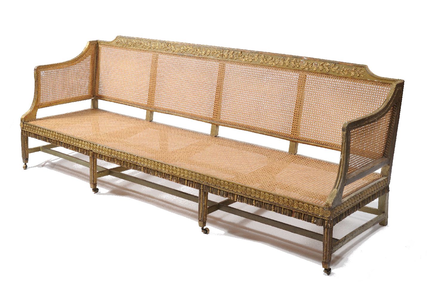 A George III gilt and green painted carved wood sofa