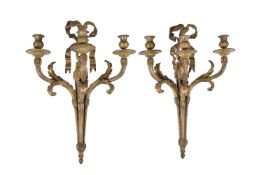 A pair of gilt bronze three light wall appliques in Louis XVI taste