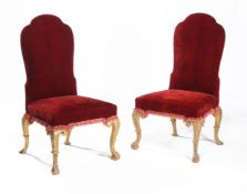 A pair of George I carved giltwood chairs